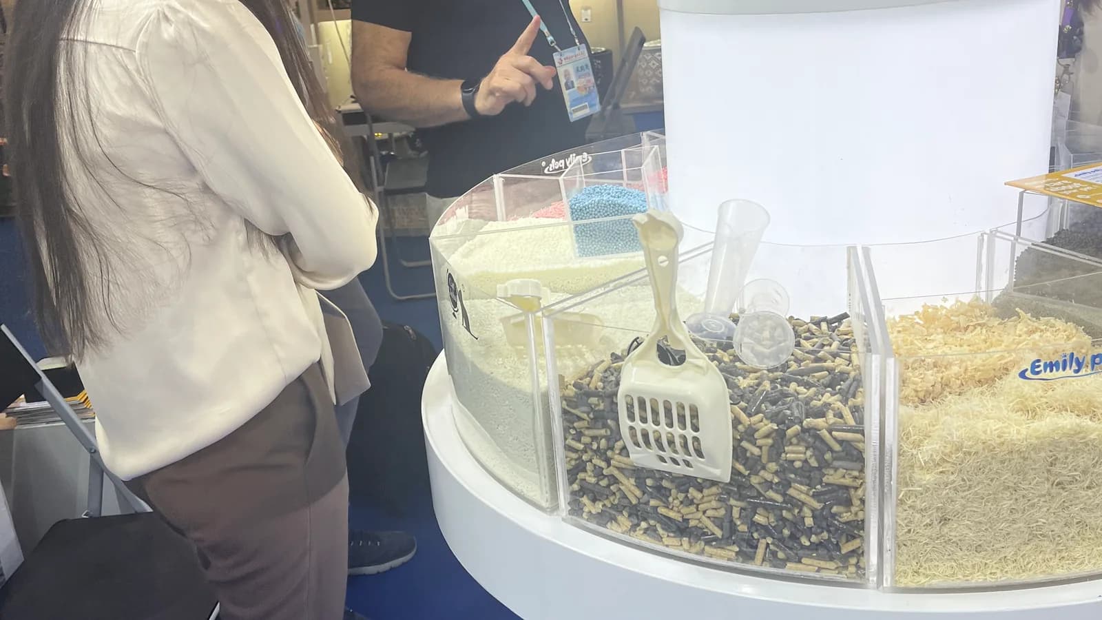 Emily pets product display with cat-litter sample materials and visitors at the 140th Canton Fair in Guangzhou